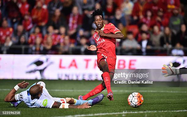 Bruce Kamau of United strikes the ball as Patrick Kisnorbo of Melbourne City attempts a tackle during the A-League Semi Final match between Adelaide...