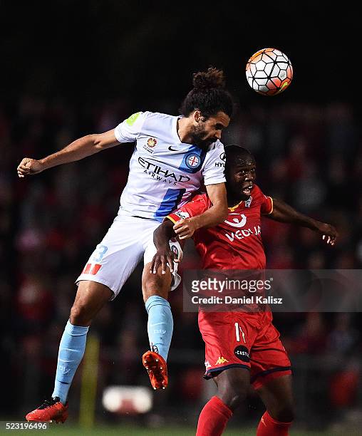 Osama Malik of Melbourne City and Bruce Djite of United attempt to header the ball during the A-League Semi Final match between Adelaide United and...
