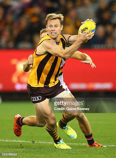 Sam Mitchell of the Hawks is tackled by David Mackay of the Crows during the round five AFL match between the Hawthorn Hawks and the Adelaide Crows...