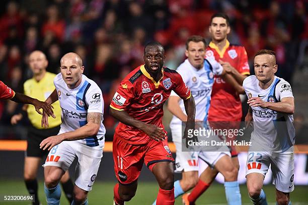 Aaron Mooy of Melbourne City and Bruce Djite of United look on during the A-League Semi Final match between Adelaide United and Melbourne City at...