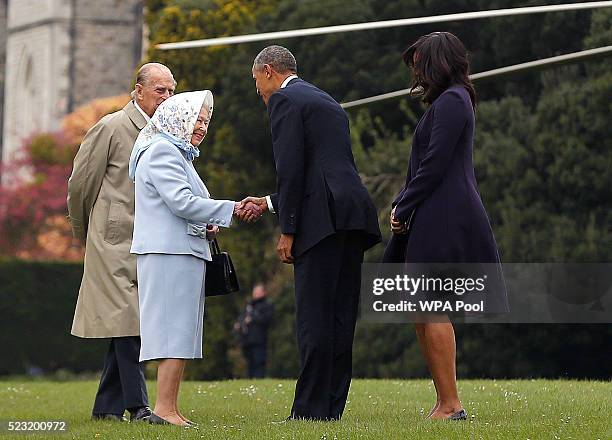 President Barack Obama and his wife First Lady Michelle Obama are greeted by Queen Elizabeth II and Prince Phillip, Duke of Edinburgh after landing...