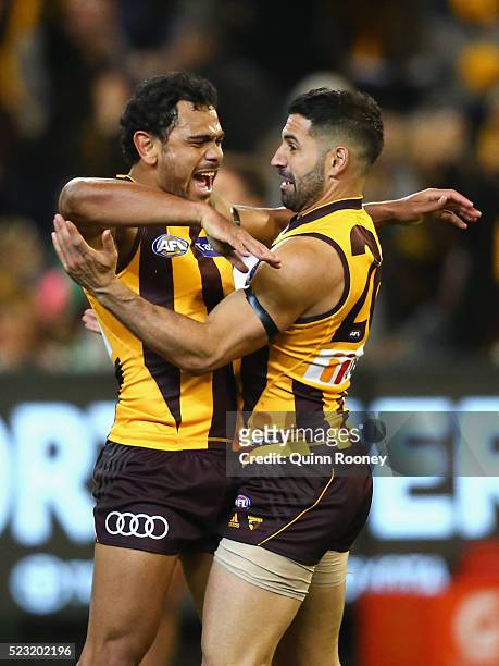 Cyril Rioli and Paul Puopolo of the Hawks celebrate a goal during the round five AFL match between the Hawthorn Hawks and the Adelaide Crows at...