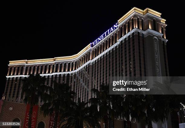 An exterior sign on top of The Venetian Las Vegas is illuminated in purple light in memory of recording artist Prince on April 21, 2016 in Las Vegas,...