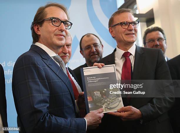 German Transport Minister Alexander Dobrindt poses with members of a commission that investigated the emissions of a wide range of European diesel...