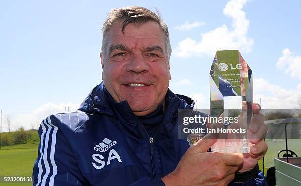 Manager Sam Allardyce shows his performance of the week award during Sunderland AFC training session at The Academy of Light on April 22, 2016 in...