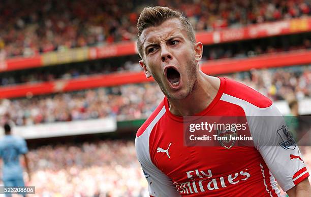 Jack Wilshere celebrates scoring during the Arsenal v Manchester City FA Premier League match at the Emirates Stadium on September 13th 2014 in London