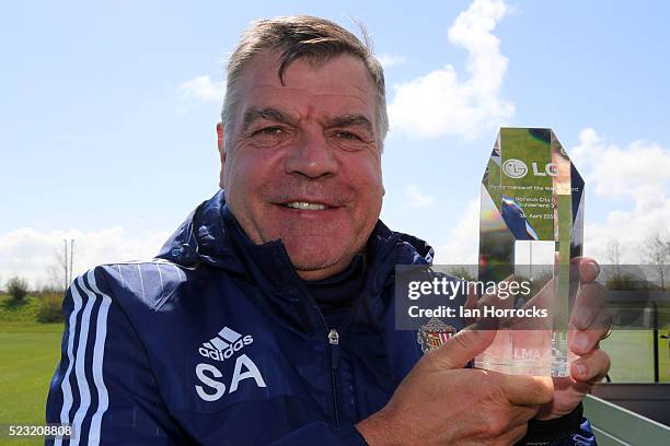 Manager Sam Allardyce shows his performance of the week award during Sunderland AFC training session at The Academy of Light on April 22, 2016 in...