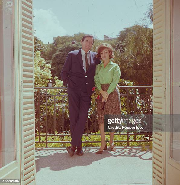American actor Gregory Peck posed with his wife Veronique Passini on a balcony in Paris in 1963.