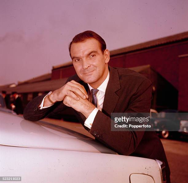 Welsh actor Stanley Baker posed wearing a suit in 1963.