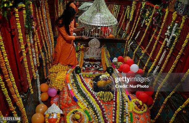 An Indian priest performs evening prayers at the Bade Hanuman Temple during Hanuman Jayanti near Sangam in Allahabad on April 22,2016. Hanuman...