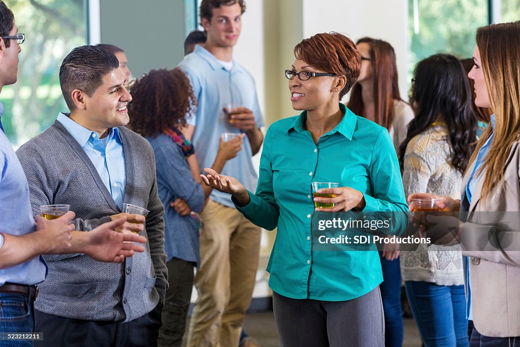 Professionals and alumni talking during mixer or party