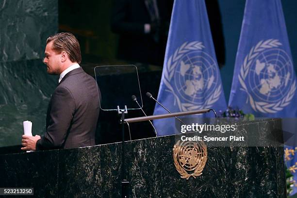 Actor and climate activist Leonardo DiCaprio walks off of the podium after speaking at the United Nations Signing Ceremony for the Paris Agreement...