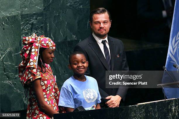 Actor and climate activist Leonardo DiCaprio stands with children at the United Nations Signing Ceremony for the Paris Agreement climate change...