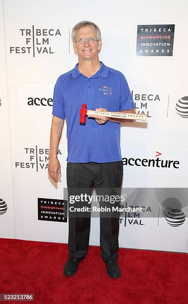 Engineer/computer scientist, stratospheric explorer Alan Eustace poses with his award at Tribeca Disruptive Innovation Awards - 2016 Tribeca Film...