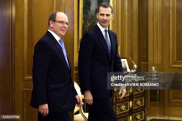 Spain's King Felipe VI and Monaco's Prince Albert II arrive to pose for media prior to a meeting at the Zarzuela Palace in Madrid, on April 22, 2016.