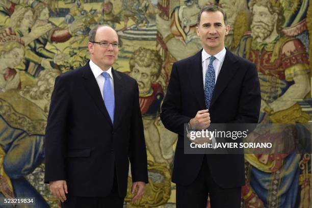 Spain's King Felipe VI and Monaco's Prince Albert II pose for media prior to a meeting at the Zarzuela Palace in Madrid, on April 22, 2016.