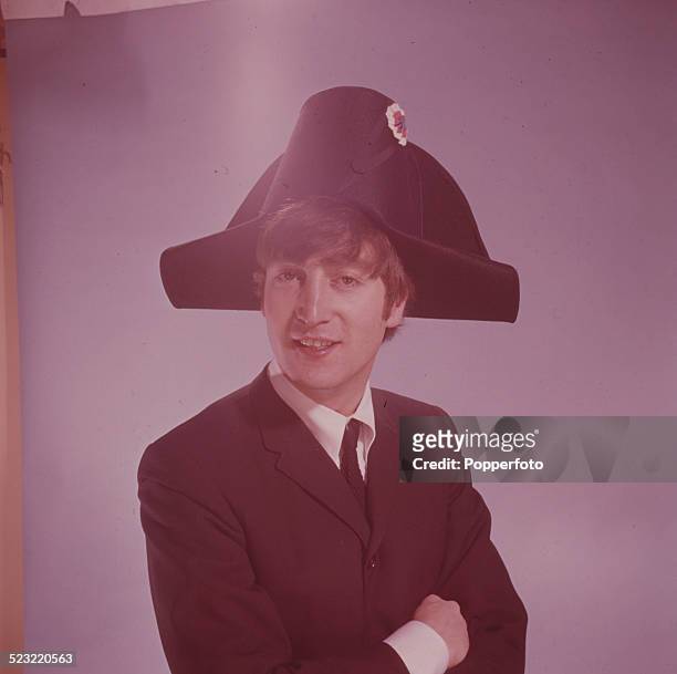 John Lennon , guitarist with the Beatles, posed wearing a bicorne hat in a photographic studio in Paris in January 1964.