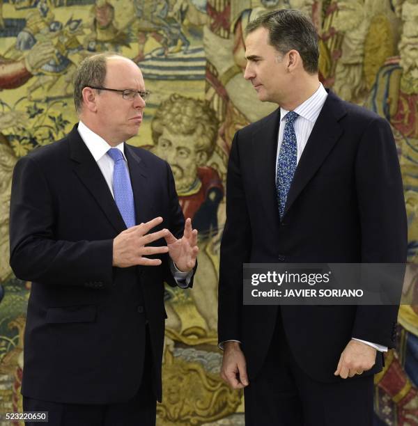 Spain's King Felipe VI and Monaco's Prince Albert II chat as they pose for media prior to a meeting at the Zarzuela Palace in Madrid, on April 22,...