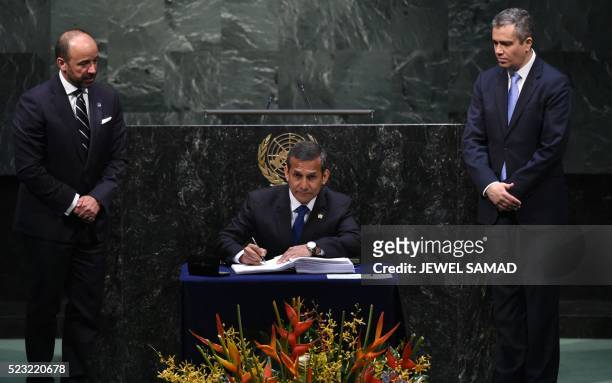 Peru's President Ollanta Humala signs the Paris Agreement during the United Nations High-Level Event for the Signature of the Paris Agreement April...