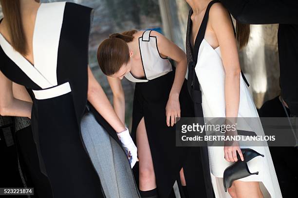 Models wearing creations by Swedish fashion designer Amanda Svart wait backstage prior to modeling before a jury during the 31st edition of the...