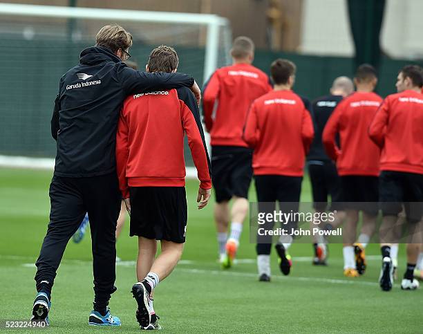 Jurgen Klopp manager of Liverpool with Lucas of Liverpool during a training session at Melwood Training Ground on April 22, 2016 in Liverpool,...