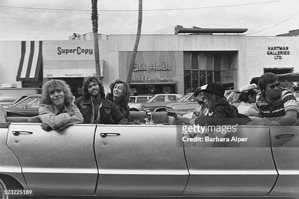 English rock musician, singer, and songwriter Peter Frampton , with singers, songwriters and record producers, Barry Gibb , and Robin Gibb in the...