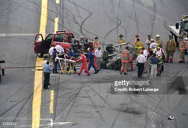 View of the aftermath of Geoffrey Bodine's accident during the Craftsman Truck Series in the Daytona 250 during Daytona Speedweeks at Daytona...