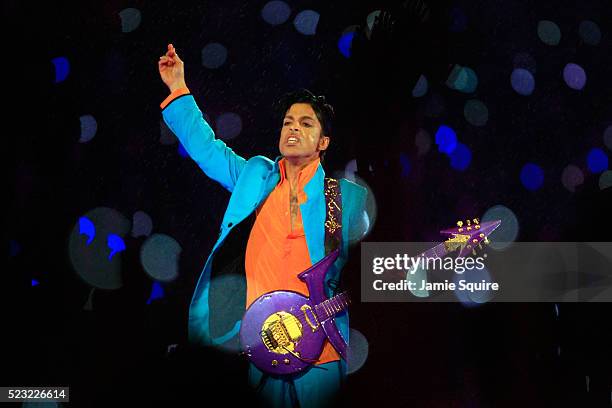 Prince performs in the rain during the 'Pepsi Halftime Show' at Super Bowl XLI between the Indianapolis Colts and the Chicago Bears on February 4,...