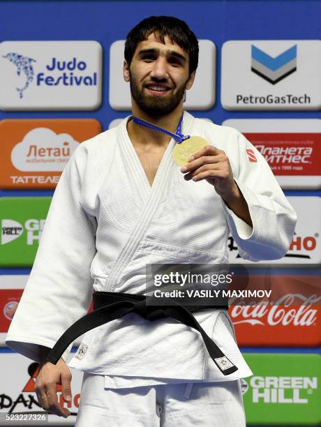 Russia's judoka Khasan Khalmurzaev poses with a gold medal after winning the -81kg category competition at the European Judo Championships in Kazan...