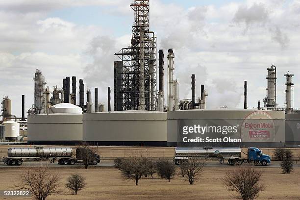 Tanker trucks drive past an ExxonMobil oil refinery March 8, 2005 in Joliet, Illinois. Gasoline prices nationwide have climbed in the past two weeks...