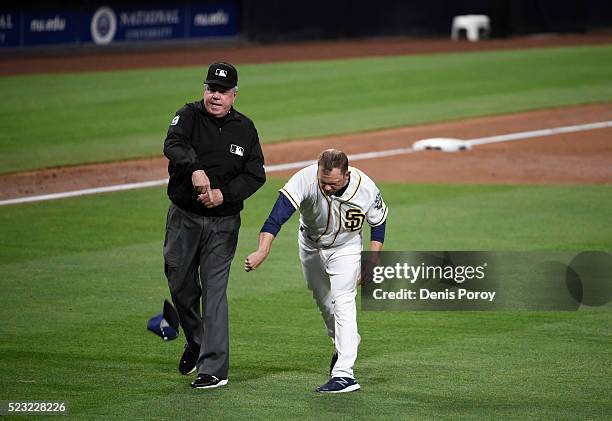 San Diego Padres manager Andy Green throws his cap as he's ejected from game by umpire Brian Gorman during the third inning of a baseball game...