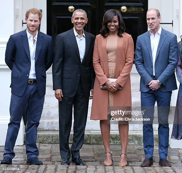 Prince Harry, US President Barack Obama, First Lady Michelle Obama and Prince William, Duke of Cambridge pose as they attend a dinner at Kensington...