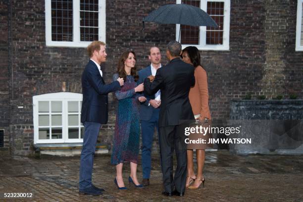 President Barack Obama and First Lady Michelle Obama are greeted by Britain's Prince William, Duke of Cambridge , his wife Catherine, Duchess of...