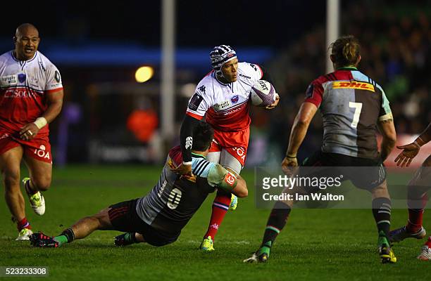 Gio Aplon of Grenoble is tackled by Ben Botica of Harlequins during the European Rugby Challenge Cup Semi Final match between Harlequins and Grenoble...