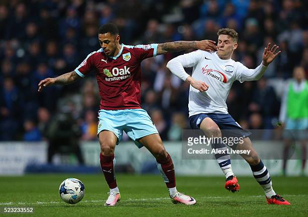 Andre Gray of Burnley holds off a challenge from Calum Woods of Preston North End during the Sky Bet Championship match between Preston North End and...