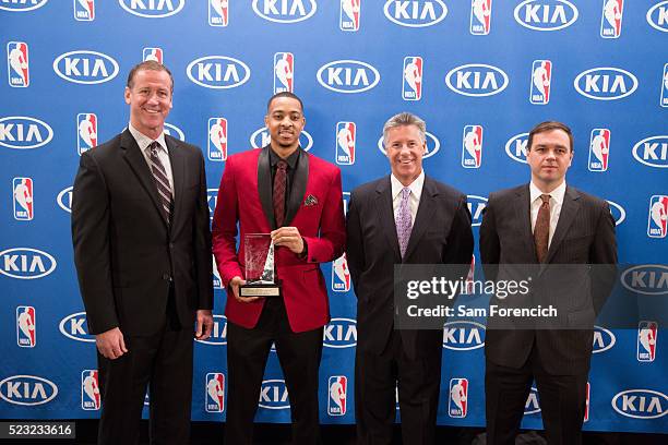 Head Coach Terry Stotts, General Manager Neil Olshey and Team President Chris McGowan joins CJ McCollum of the Portland Trail Blazers as he receives...