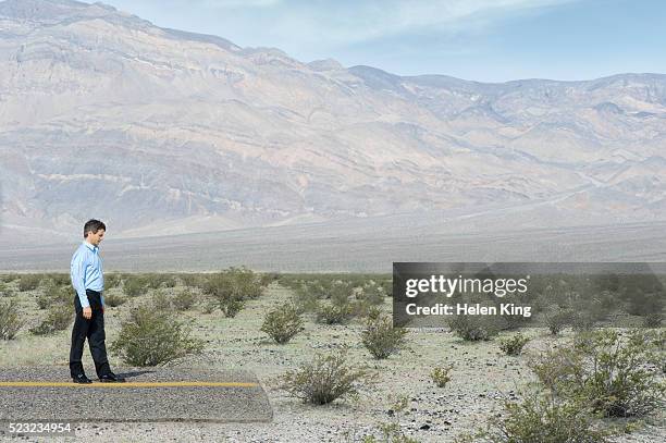 man reaching the end of the road - dead end stock pictures, royalty-free photos & images