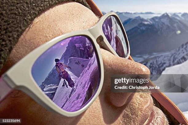 young climber looking through sunglasses, tyrol, austria - ski closeup imagens e fotografias de stock