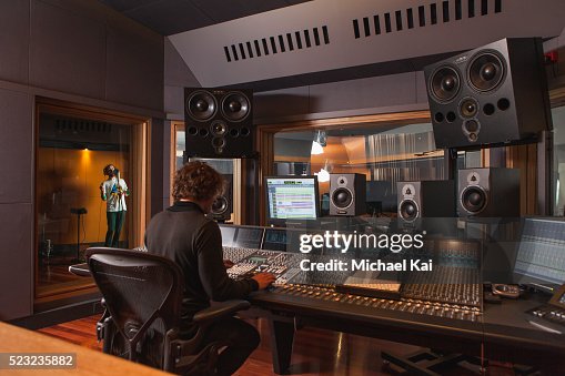 Sound engineer using mixing desk Sound engineer using mixing desk