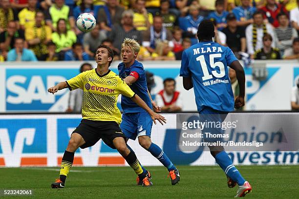 Andreas Beck and Paniel Mlapa of Hoffenheim fights for the ball with Ivan Perisic of Dortmund during the Bundesliga match between 1899 Hoffenheim and...
