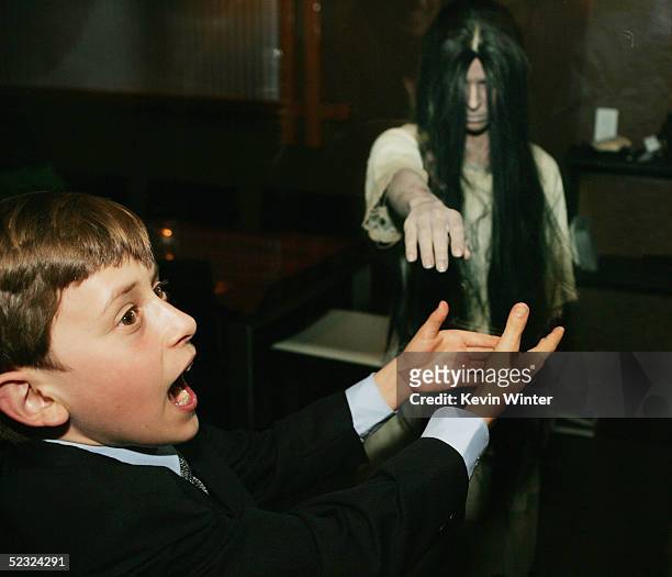 Actor David Dorfman poses with the dead girl from the movie at the afterparty for DreamWorks Pictures' "The Ring Two" at the Geisha House on March 8,...