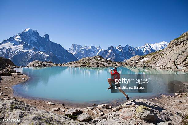 running for joy at lake blanc chamonix - peak performance stock pictures, royalty-free photos & images