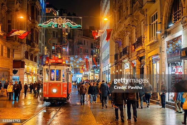christmas lights, national flags and tramway in istanbul, turkey - istanbul street stock pictures, royalty-free photos & images