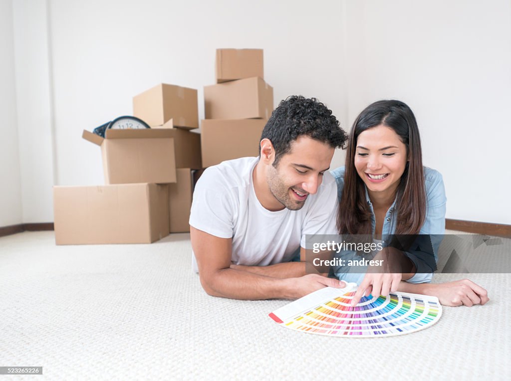 Couple painting their house