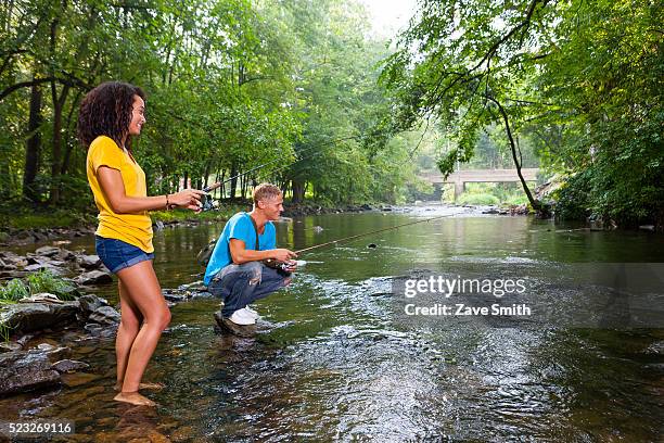 young couple fishing in river, coatesville, pennsylvania, usa - coatesville stock pictures, royalty-free photos & images