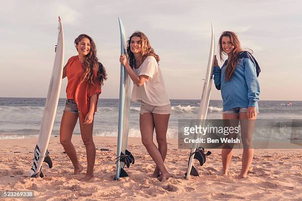 group of teenagers (16-17) with surfboards on beach, tarifa, costa de la luz, cadiz, andalusia, spain - tarifa stock pictures, royalty-free photos & images