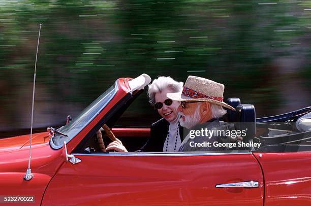 senior couple driving in a convertible - rich old man stock pictures, royalty-free photos & images