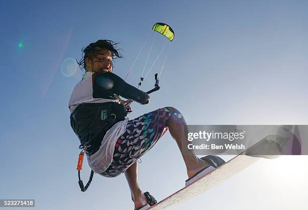 portrait of young man kitesurfing - kite surfing stock pictures, royalty-free photos & images