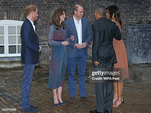 President Barack Obama and First Lady Michelle Obama are greeted by Prince Harry, Prince William, Duke of Cambridge and Catherine, Duchess of...