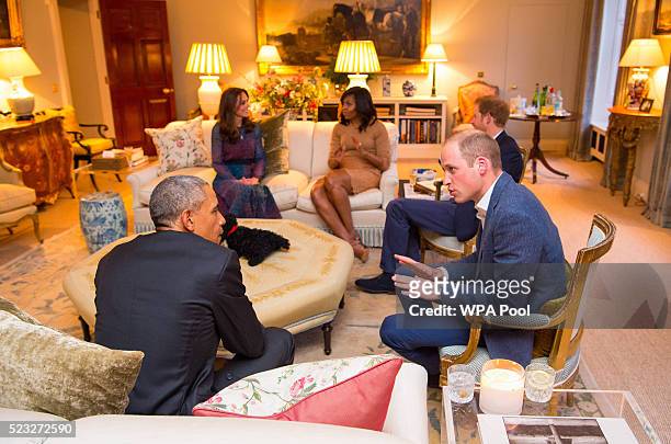 Prince William, Duke of Cambridge speaks with US President Barack Obama as Catherine, Duchess of Cambridge speaks with First Lady of the United...